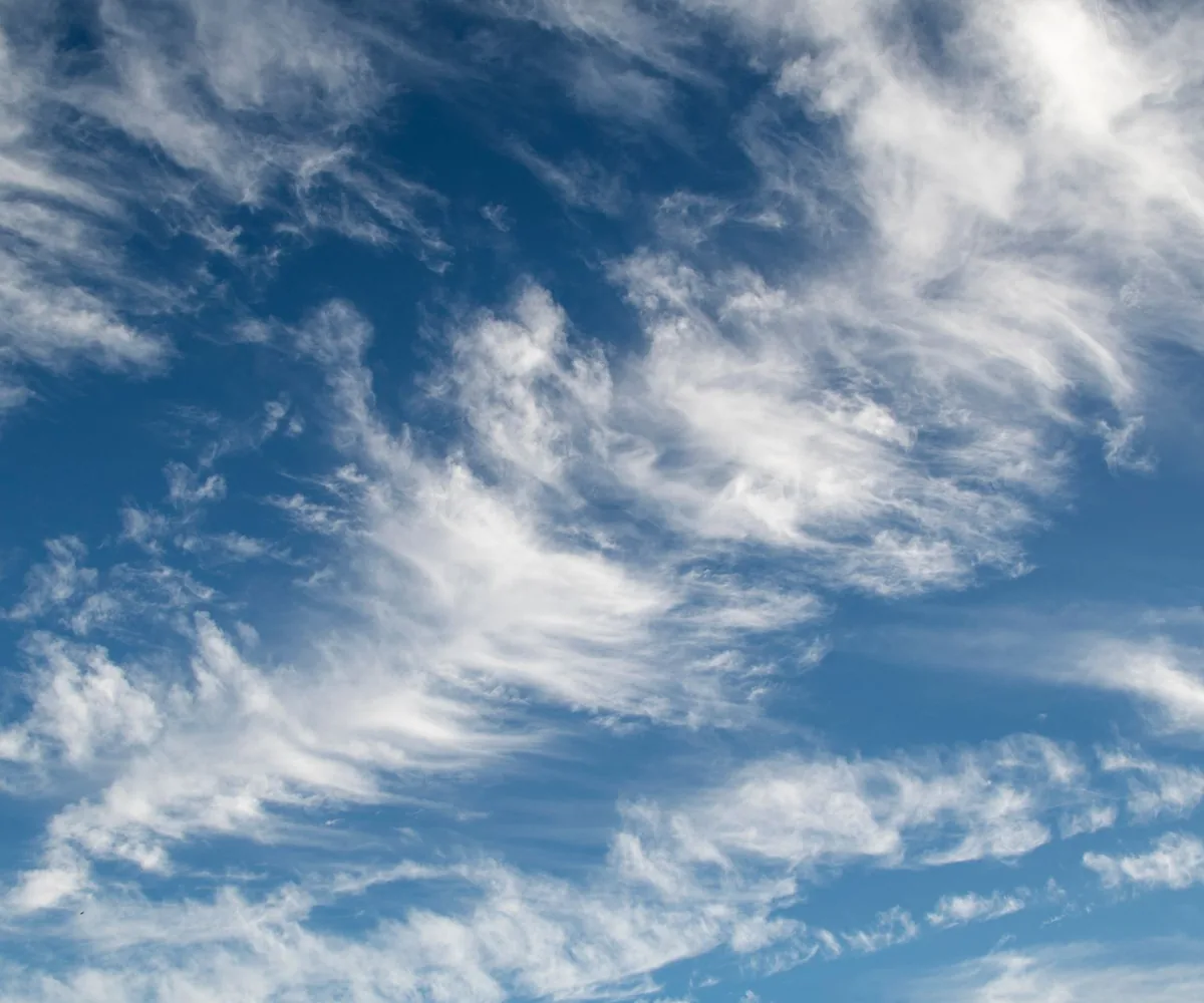Cirrus cloud drawn thin across a deep blue sky